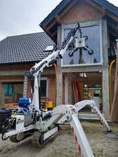Remote controlled mini crane for working in difficult terrain